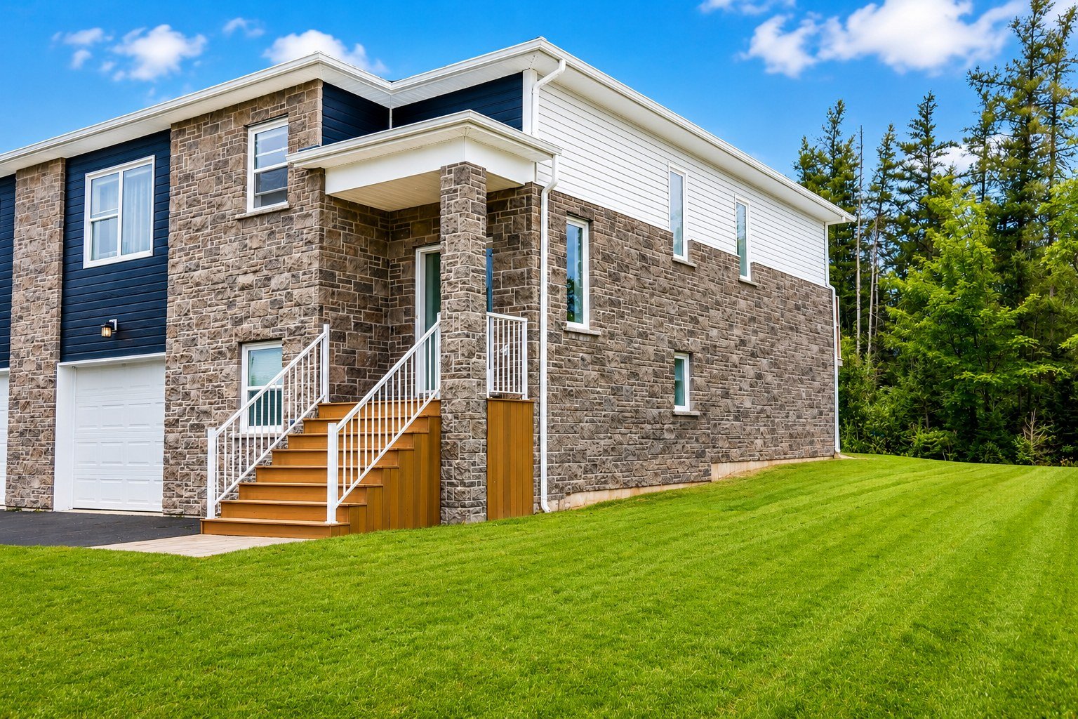 Exterior view of Starz at Night Luxury Suite under a clear blue sky, surrounded by trees and green lawn