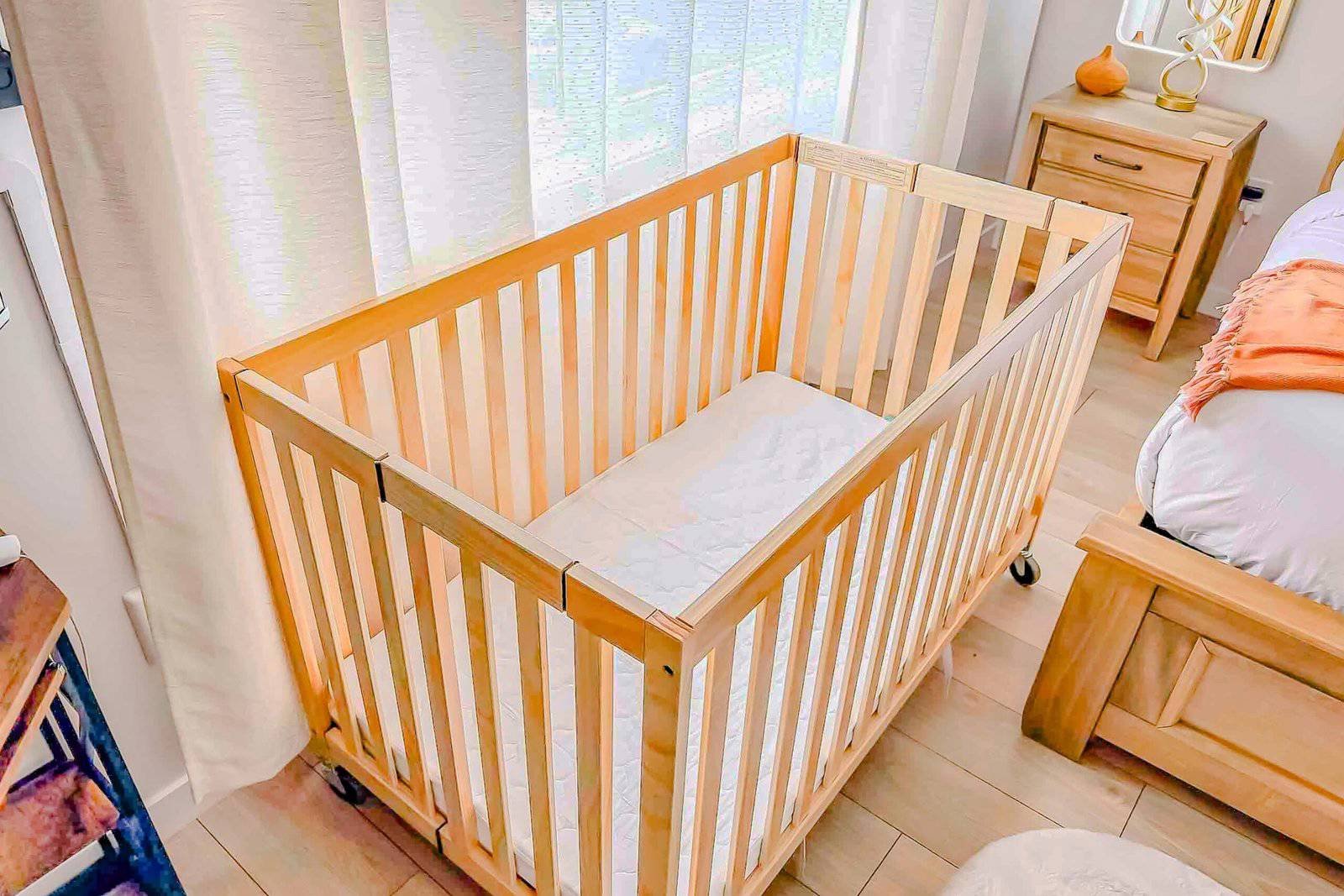 Crib in a bedroom at Starz at Night, ready for a child ages 0-3