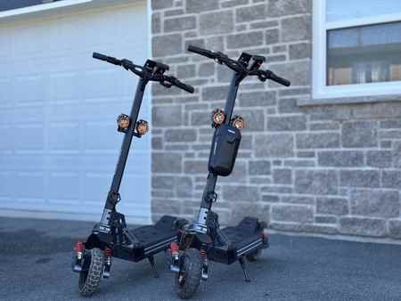 Two Hiboy off-road electric scooters available for guest use at Starz at Night Luxury Suite in Lantz, Nova Scotia