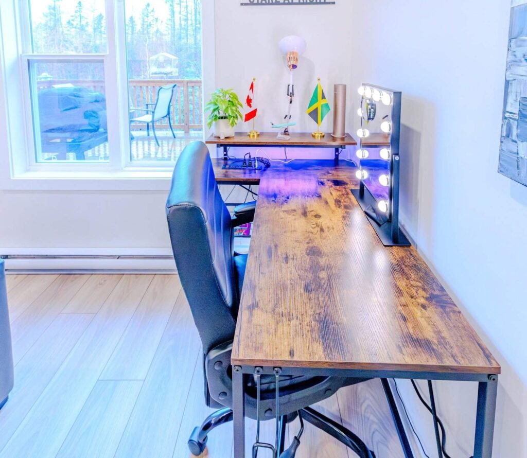 Dedicated workspace desk with lighted vanity mirror at Starz at Night Luxury Suite in Lantz, Nova Scotia